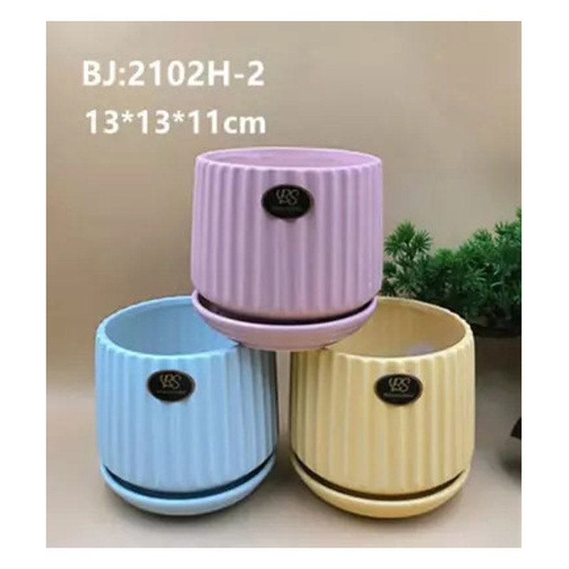 Fluted ceramic pot with saucer, pastel