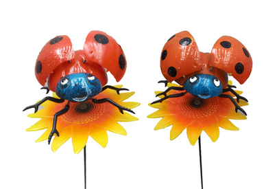 Ladybird on sunflower garden stakes